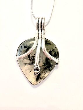 2 inch, heart shaped, 925 marked, Prehnite pendant on a silver chain.